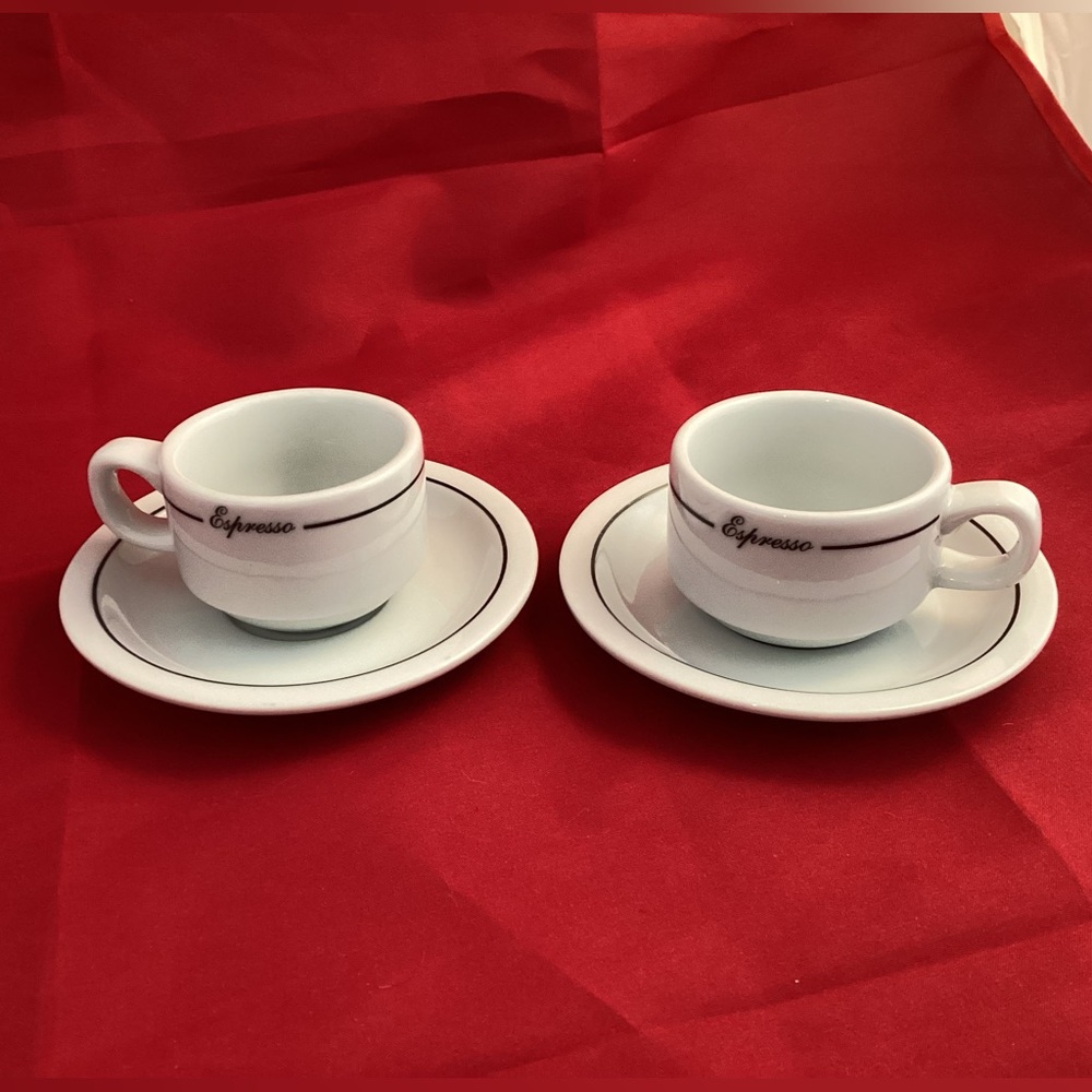 Two Armand Lebel Espresso mugs and saucers